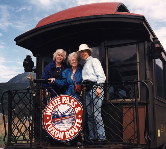 1Clara May and her daughters on a train at Skagway, Alaska